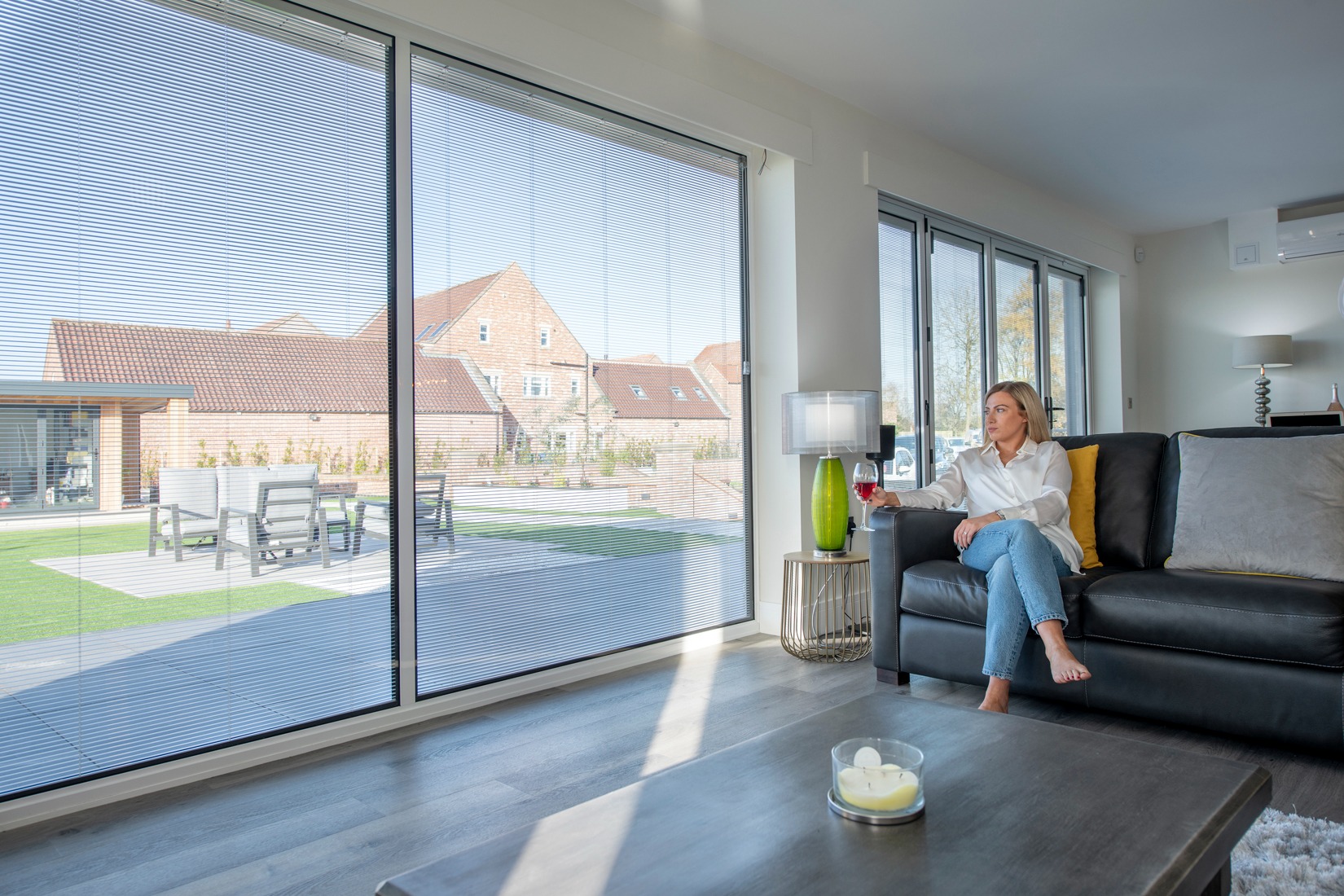 Living room with integrated shading in large glazed doors