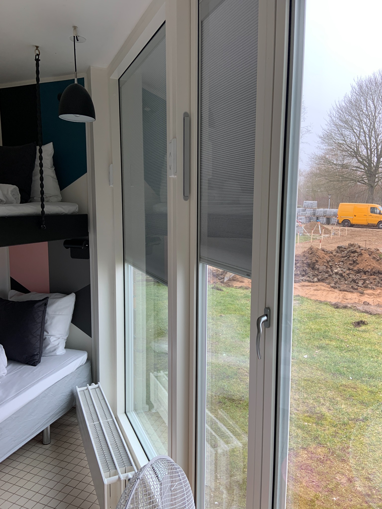 Glazed door with integrated blind in a residential room