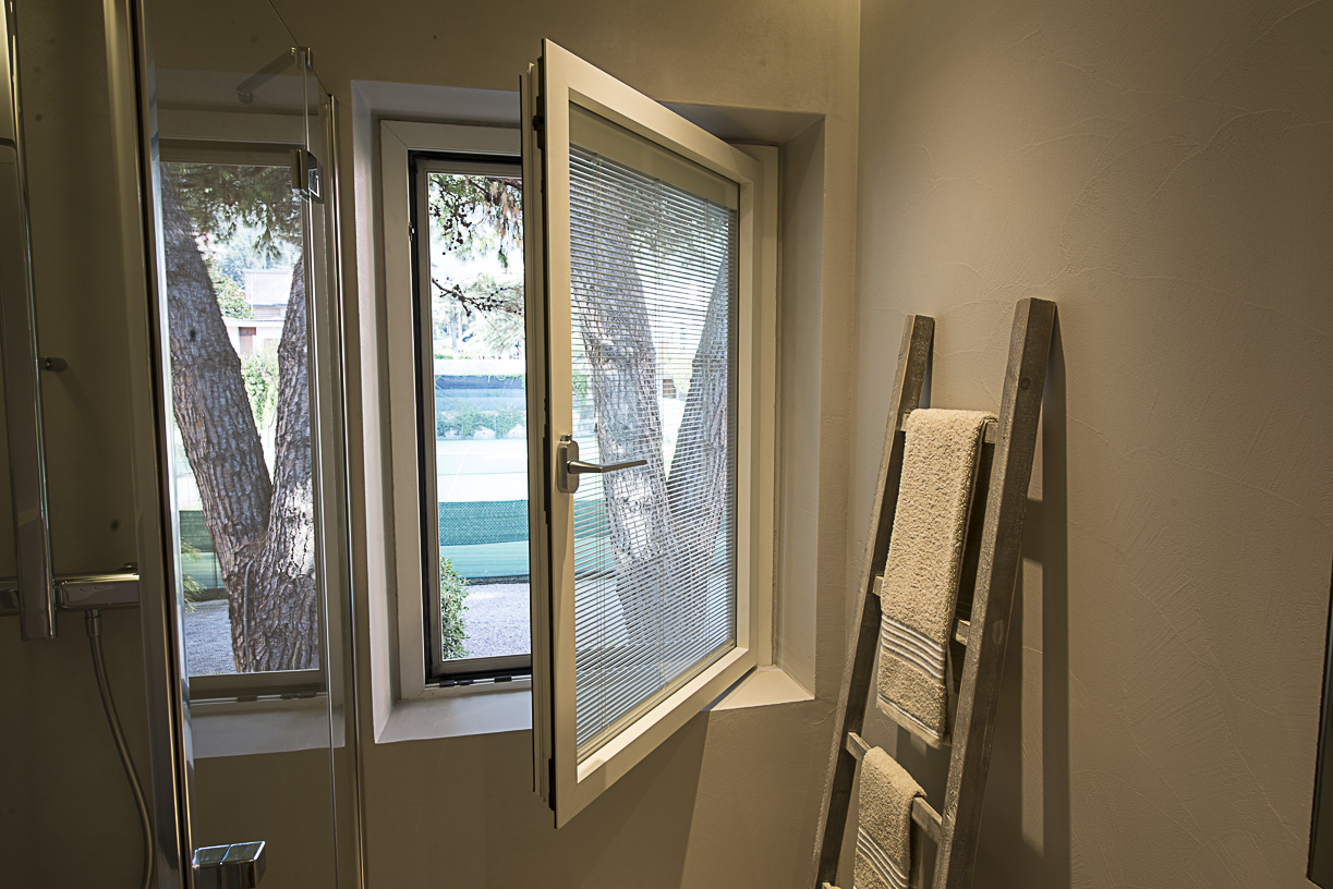 Bathroom window with integrated blind
